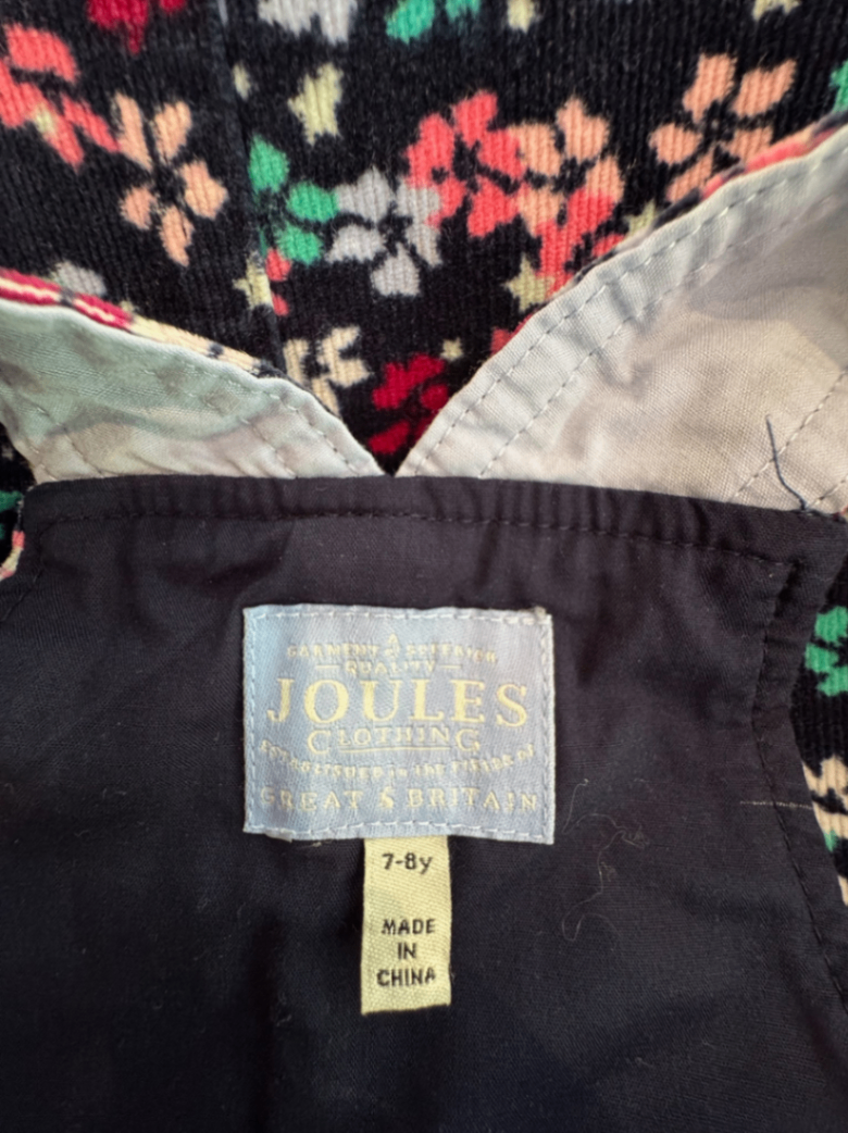 Latzrock Dunkelblau mit Blumenmuster in Pink, Türkis, Weiß Gr.122 | Joules