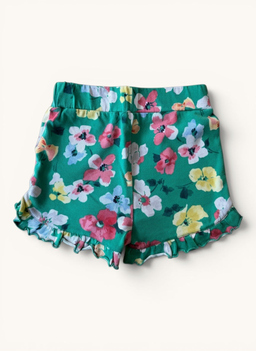 Mädchen Jersey Sommershorts – Grüne kurze Hose mit Allover-Blumenmuster & Rüschen Gr.116 | tom Joules