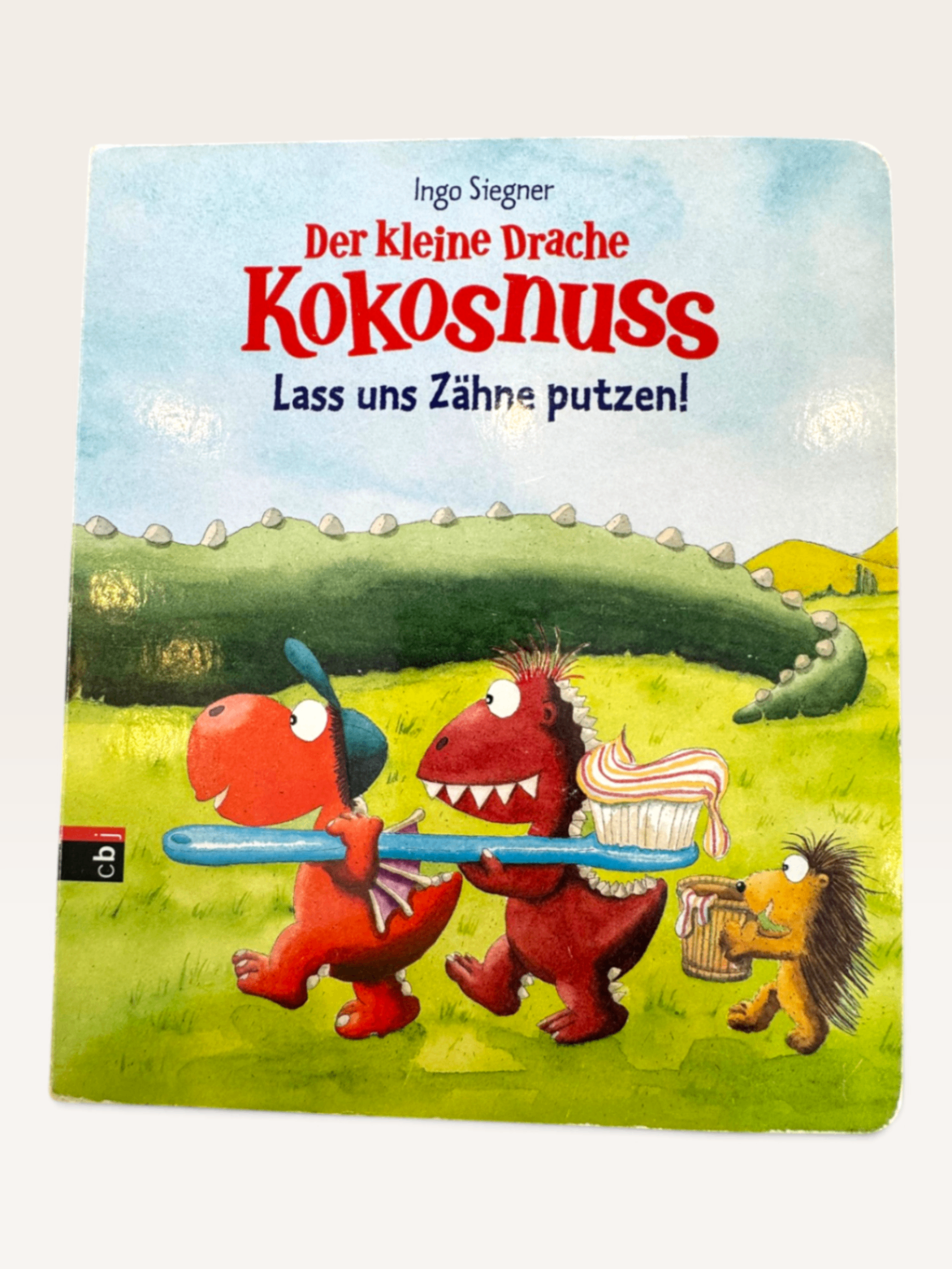 Pappbilderbuch „Der kleine Drache Kokosnuss – Lass uns Zähne putzen!“ (Ingo Siegner) | cbj Verlag