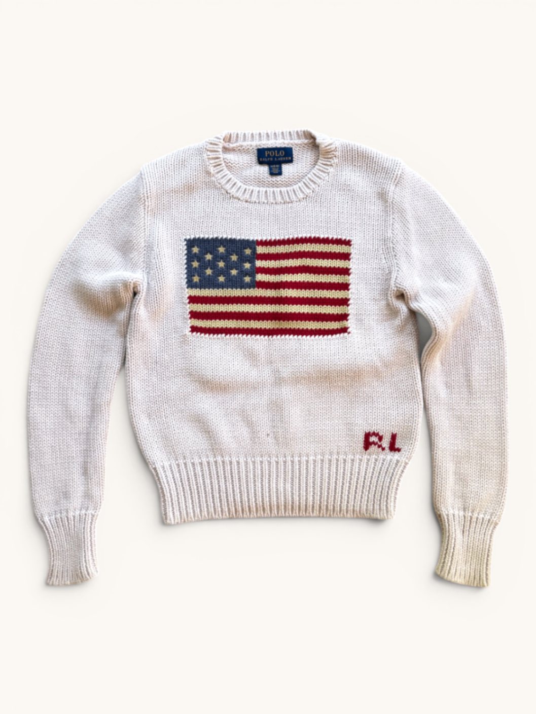Jungs & Deerns Polo Ralph Lauren Baumwollpullover in Creme mit eingestrickter USA-Flagge und rotem RL-Logo am Saum